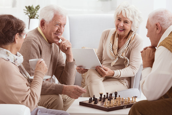 Chess competition between two older friends in nursing home